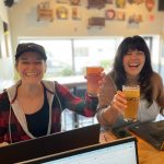 Photo of two E-Power employees at a client (Fifth Ward brewing)