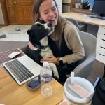 Photo of an employee working with a dog in the office